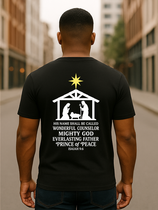 Person wearing black shirt with nativity scene and Isaiah 9:6