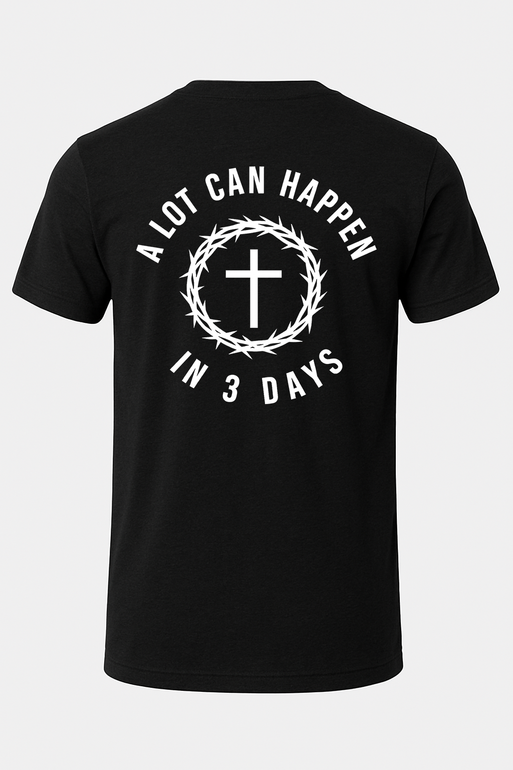Black t-shirt with white text and cross design on a light gray background
