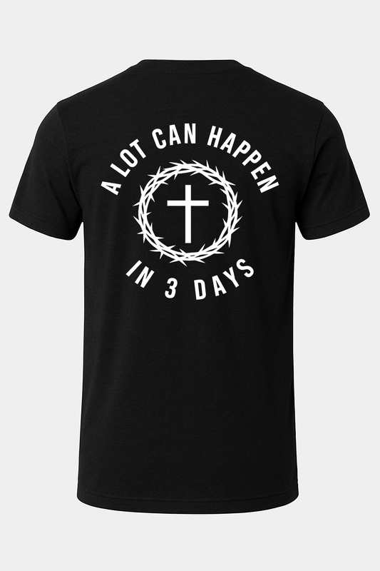 Black t-shirt with white text and cross design on a light gray background